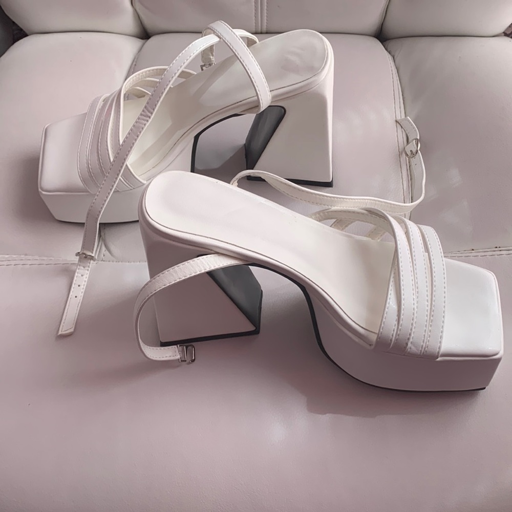Size 7 white platforms brand new without tags. Never worn